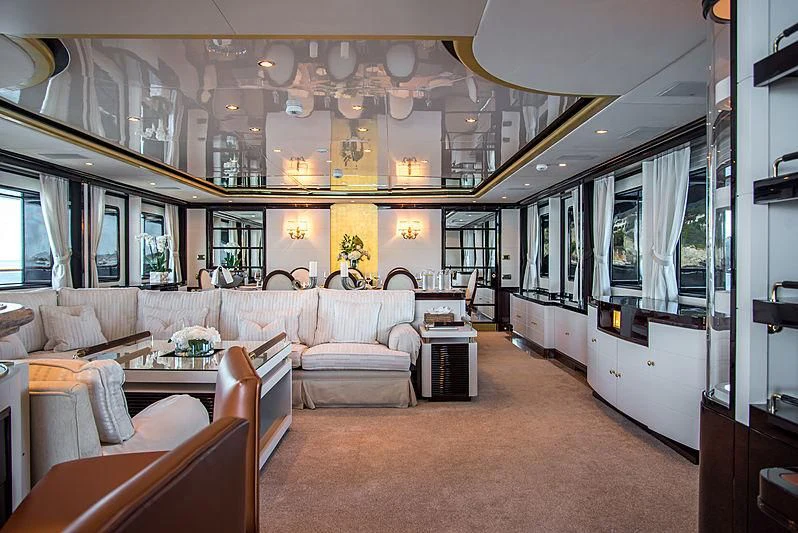 a large living room with a large chandelier aboard DIANE Yacht for Charter