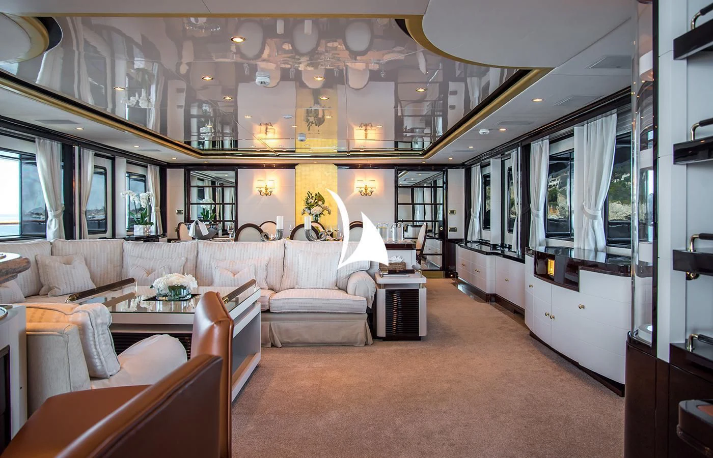 a living room with a large chandelier aboard DIANE Yacht for Charter