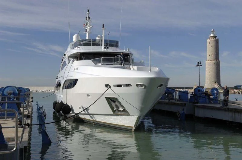 a boat docked at a pier aboard DIANE Yacht for Charter