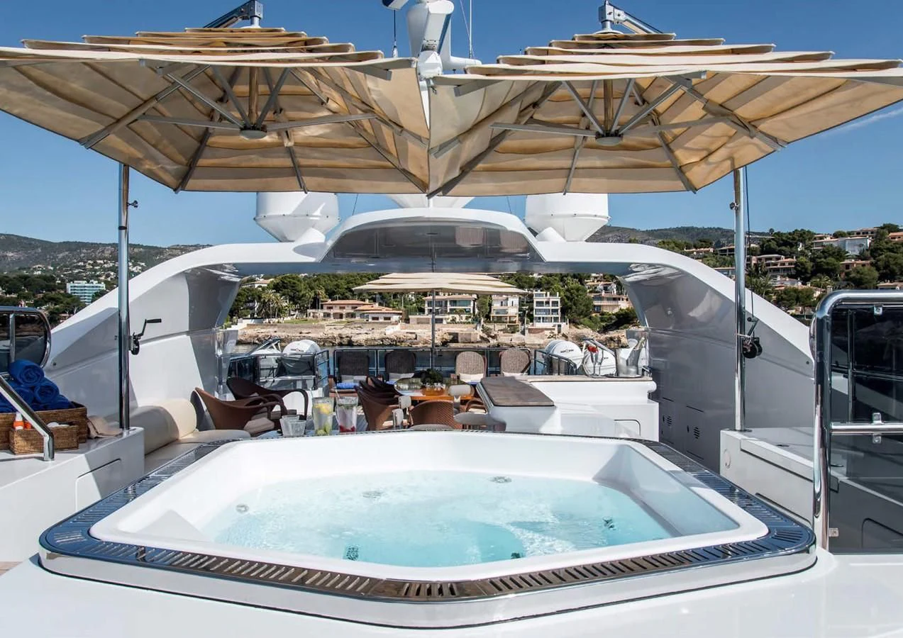 a large white boat with a large white canopy aboard DIANE Yacht for Charter