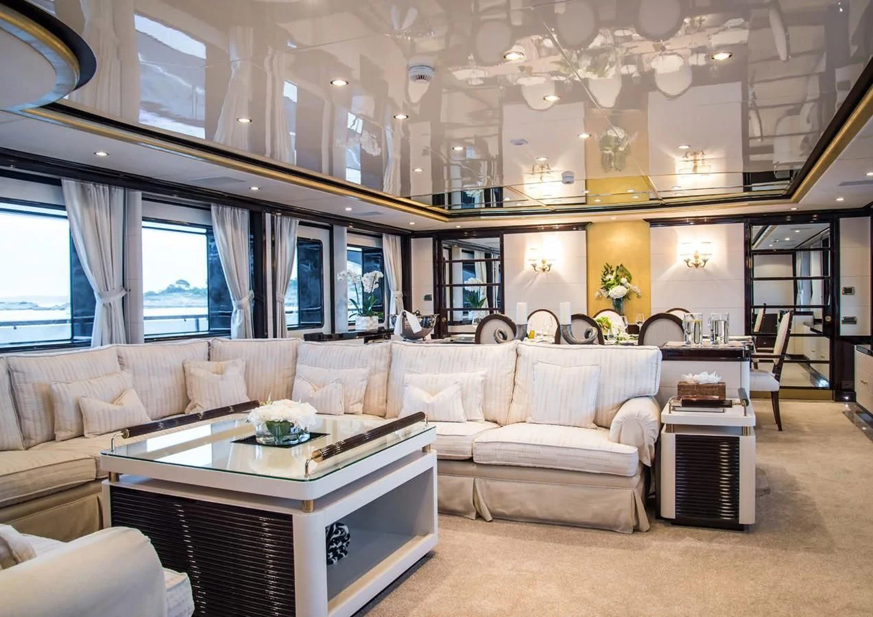 a living room with a large window aboard DIANE Yacht for Charter