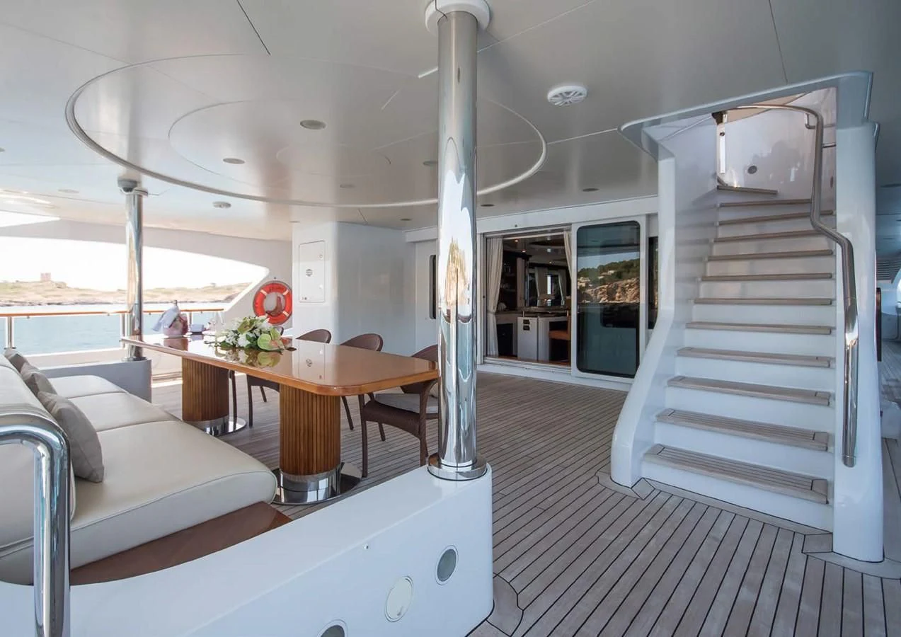 a room with a table and a couch aboard DIANE Yacht for Charter