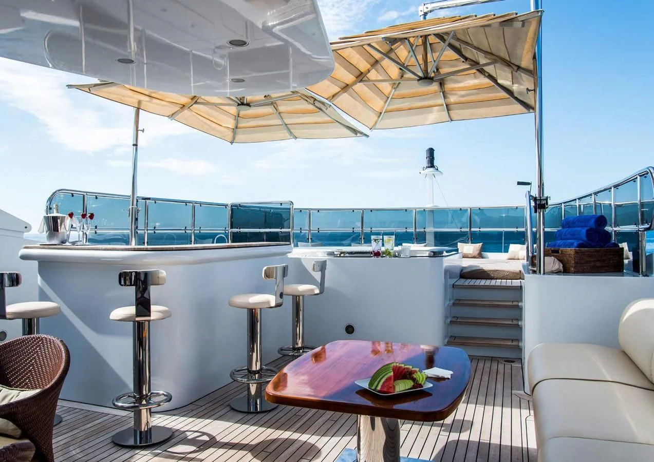 a table and chairs on a patio aboard DIANE Yacht for Charter