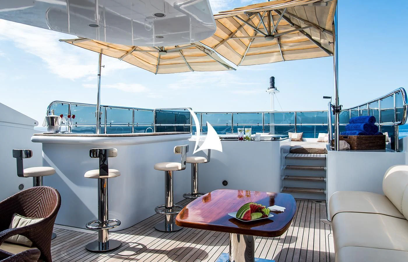 a table with chairs and a large window overlooking a large body of water aboard DIANE Yacht for Charter