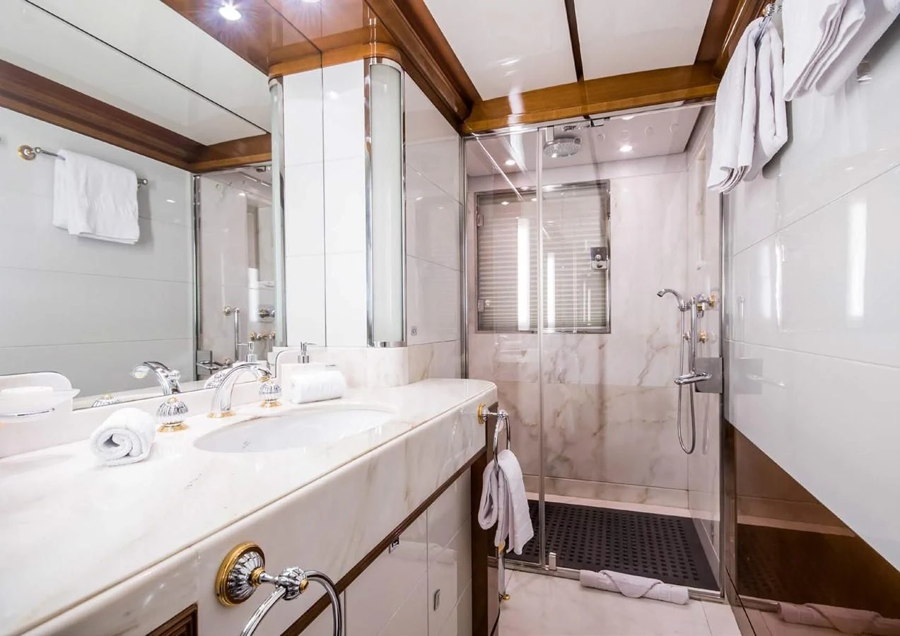 a bathroom with a sink and a mirror aboard DIANE Yacht for Charter