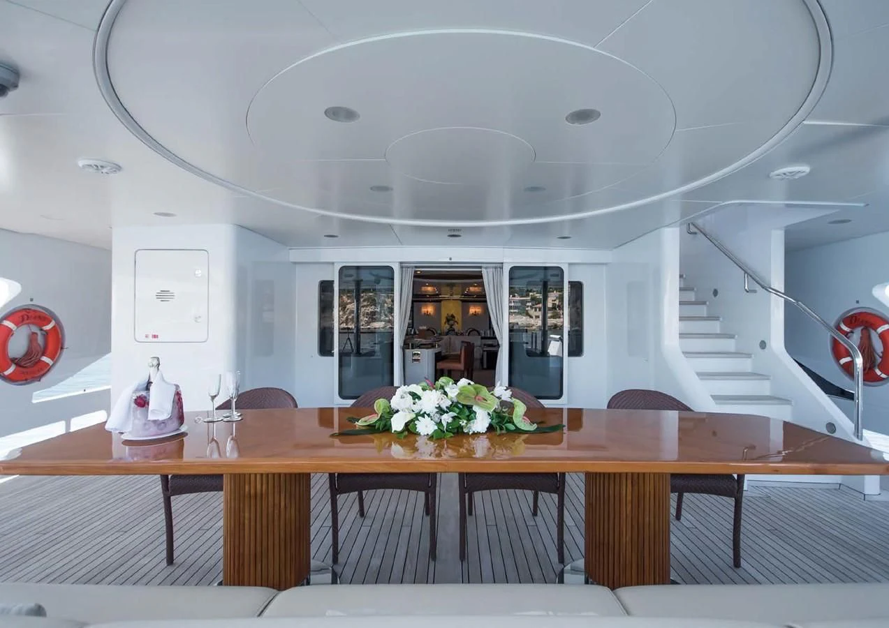 a room with a table and chairs aboard DIANE Yacht for Charter