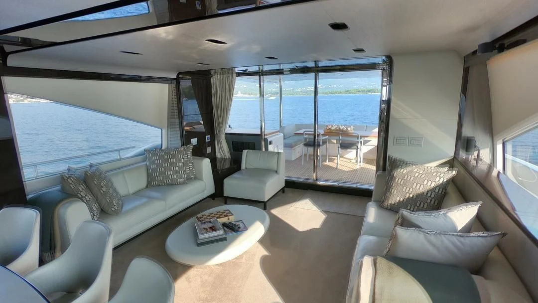 a living room with a large window aboard SOARING Yacht for Sale