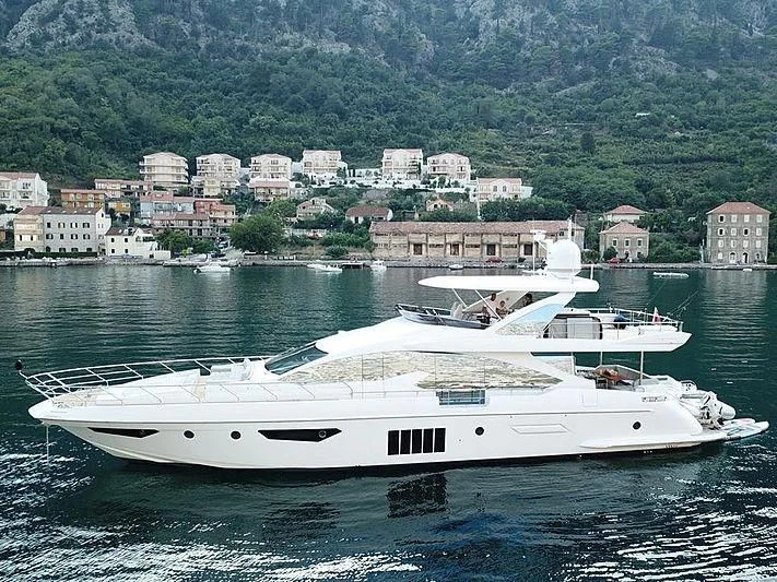 a white yacht in the water aboard SOARING Yacht for Sale