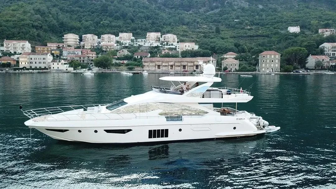 a white boat on the water aboard SOARING Yacht for Sale