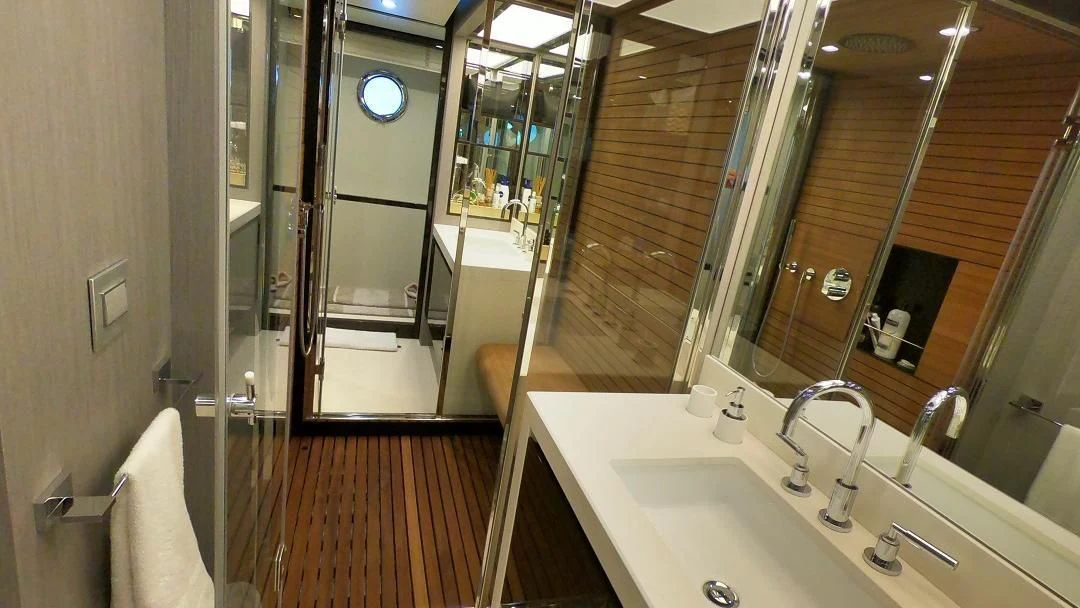 a bathroom with a large mirror aboard SOARING Yacht for Sale