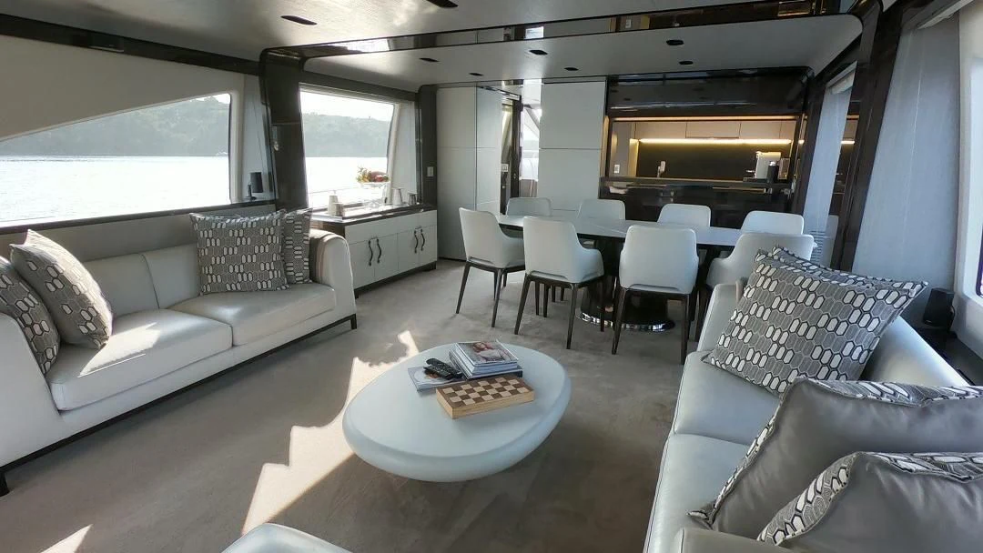 a living room with a couch and a coffee table aboard SOARING Yacht for Sale