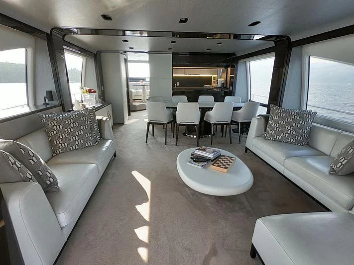 a living room with a couch and a table aboard SOARING Yacht for Sale