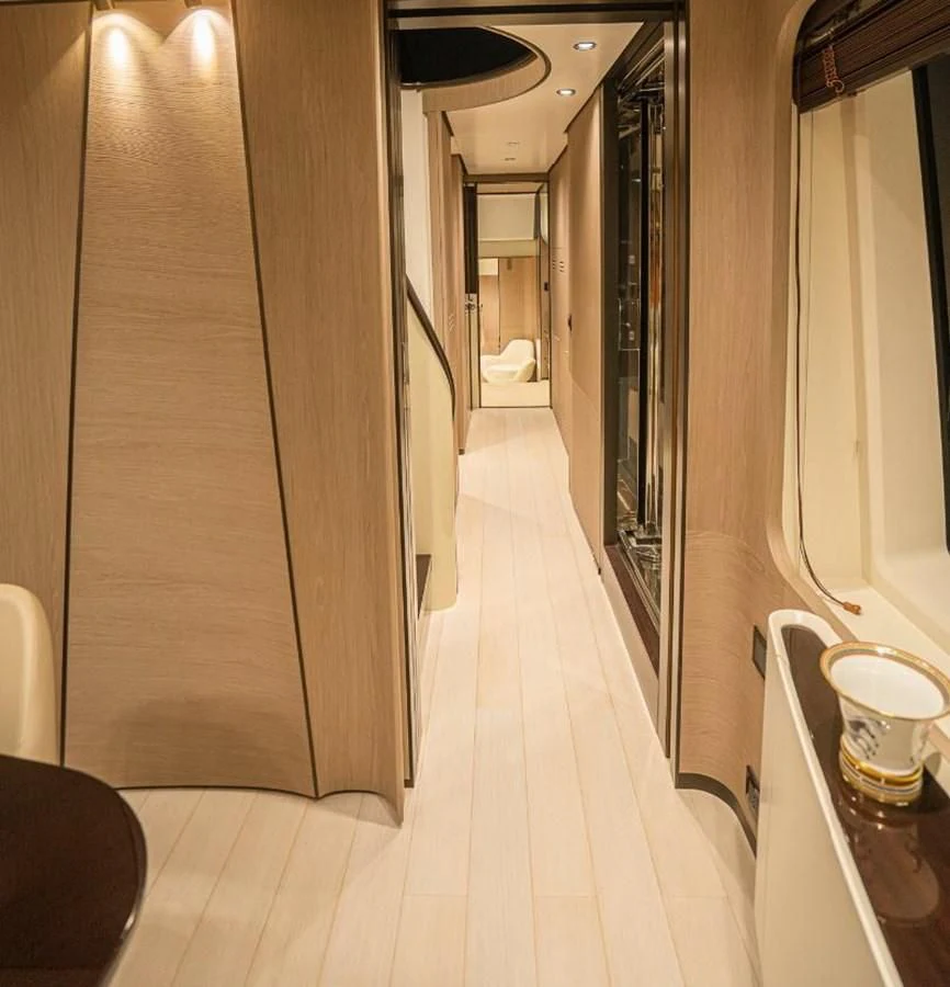 a hallway with a glass door aboard LULWA Yacht for Sale