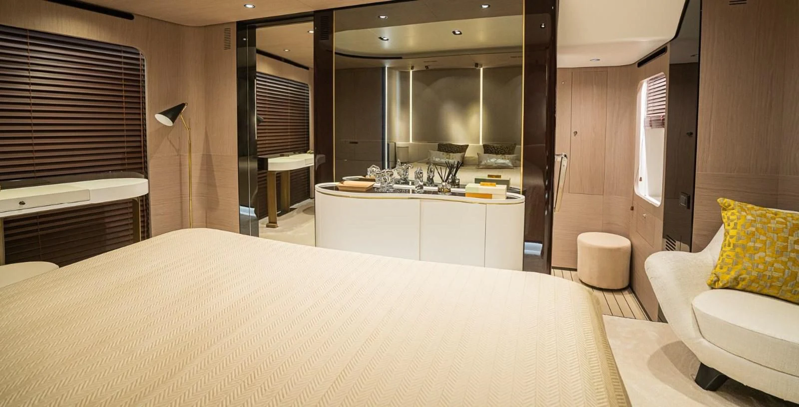 a hotel room with a bed and a mirror aboard LULWA Yacht for Sale