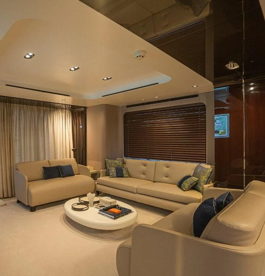 a living room with a couch and a coffee table aboard LULWA Yacht for Sale