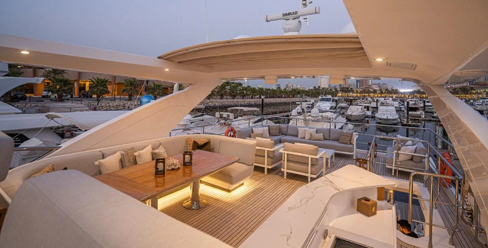 a large room with tables and chairs aboard LULWA Yacht for Sale