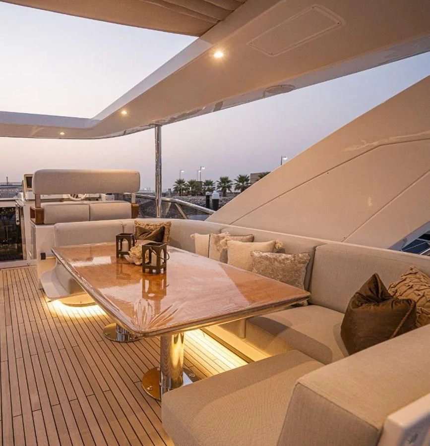 a living room with a couch and a table aboard LULWA Yacht for Sale