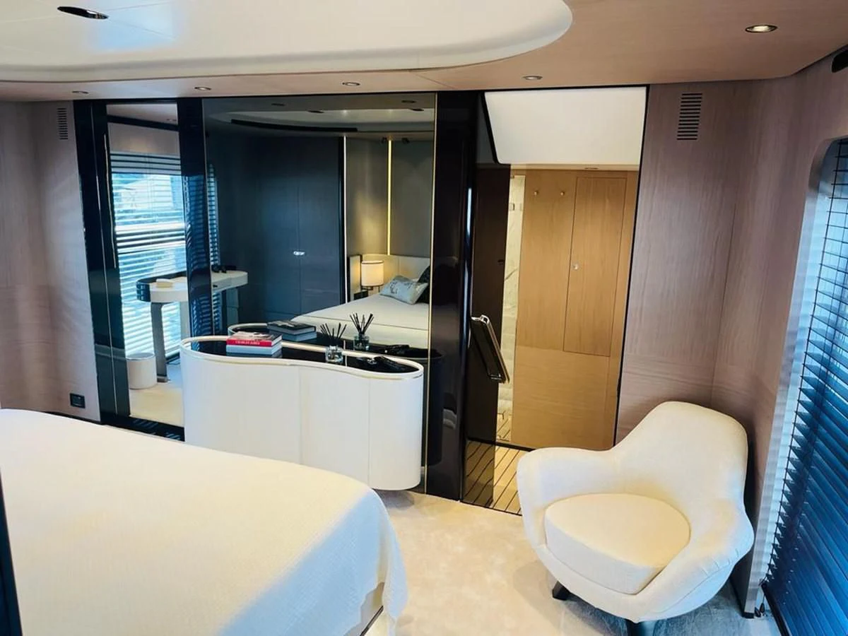 a room with a bed and desk aboard LULWA Yacht for Sale
