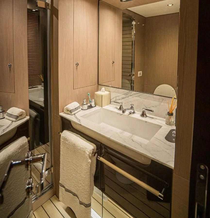 a bathroom with a sink and a mirror aboard LULWA Yacht for Sale
