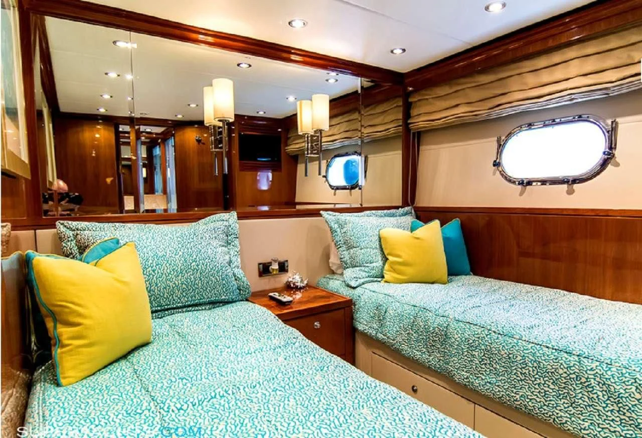 a couple of beds in a hotel room aboard CYNDERELLA Yacht for Sale