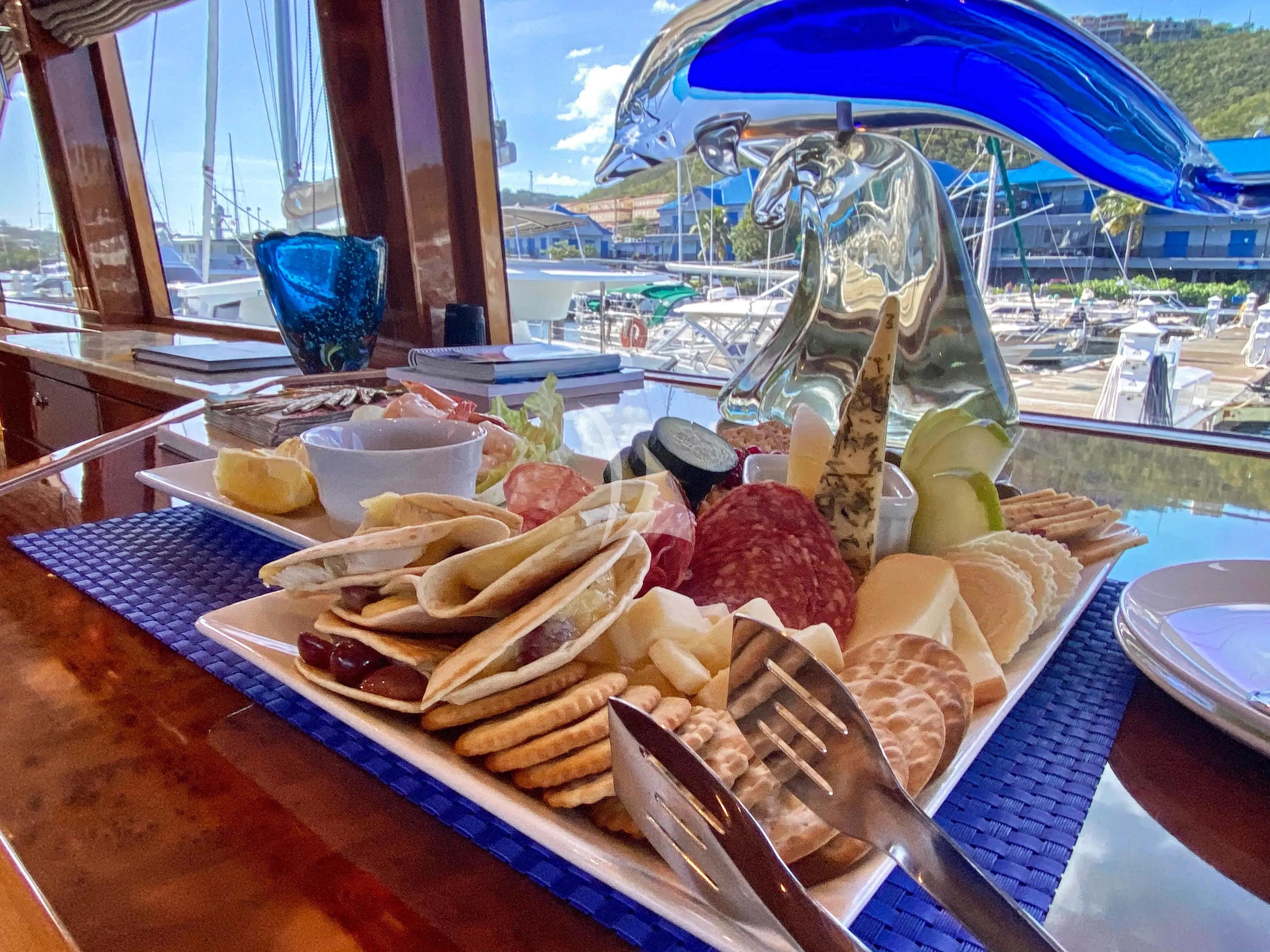 a table with food on it aboard CYNDERELLA Yacht for Sale
