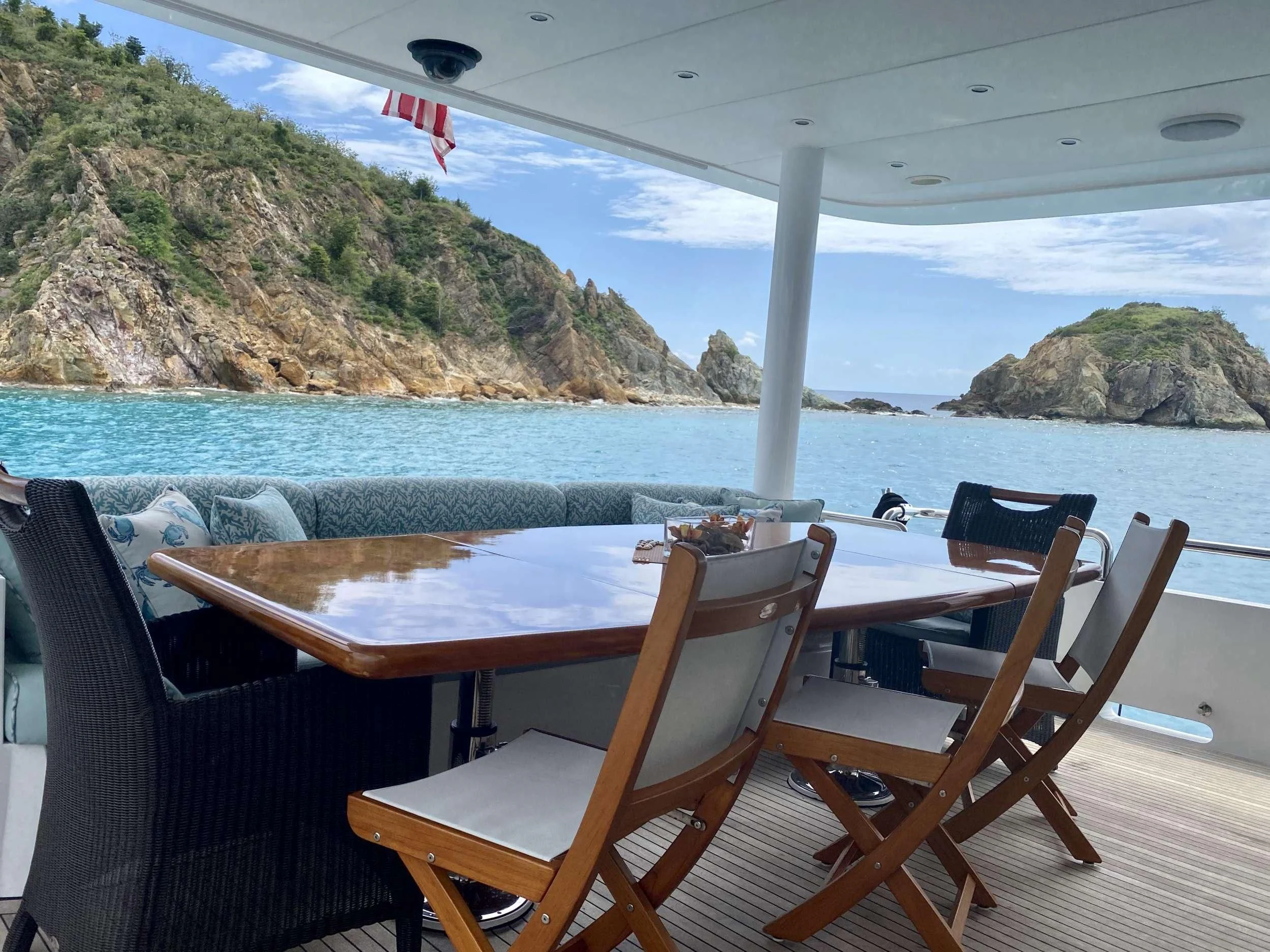 a table and chairs on a beach aboard CYNDERELLA Yacht for Sale