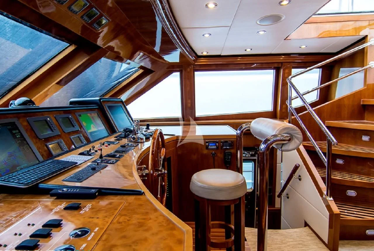 a room with a table and chairs aboard CYNDERELLA Yacht for Sale