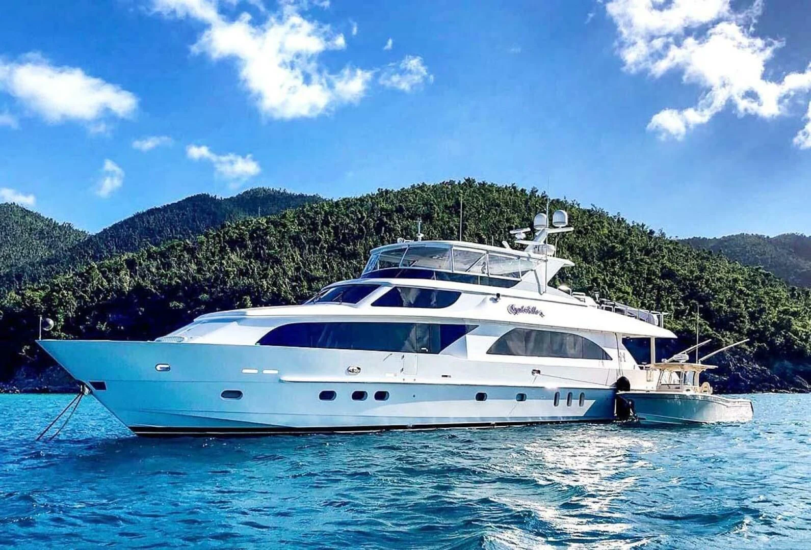 a white yacht on the water aboard CYNDERELLA Yacht for Sale