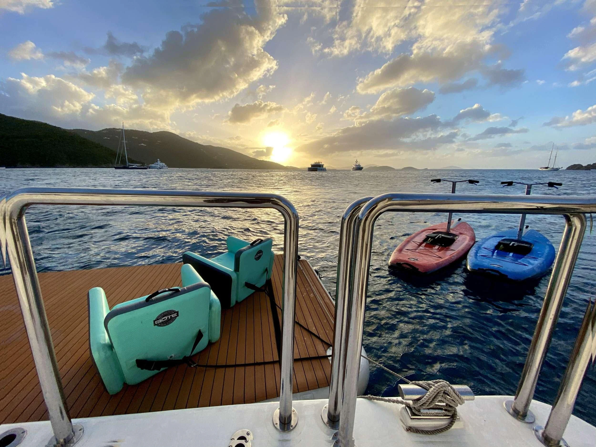 a boat with green and red seats on a body of water aboard CYNDERELLA Yacht for Sale