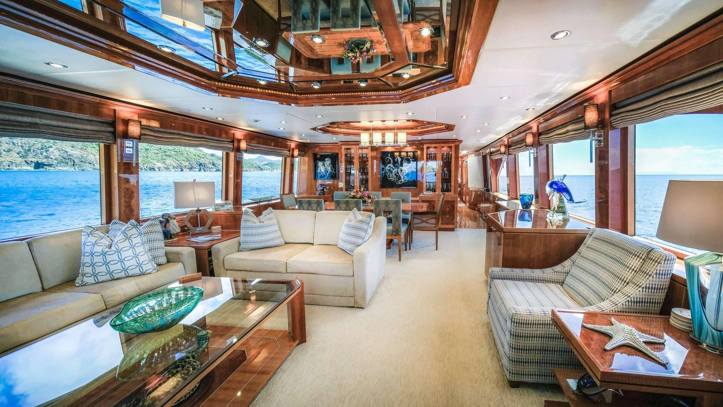 a living room with a large open window aboard CYNDERELLA Yacht for Sale