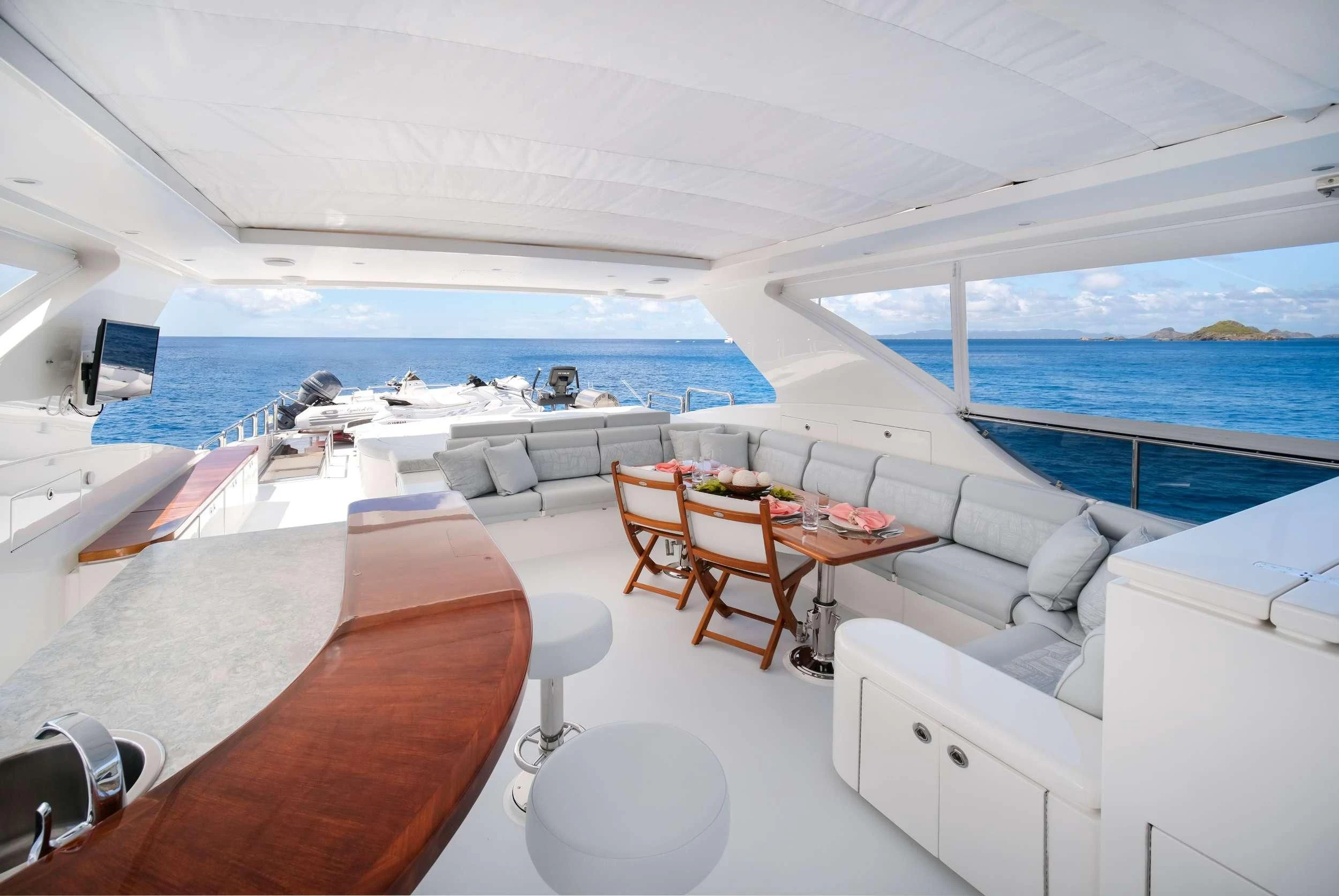 a room with a table and chairs aboard CYNDERELLA Yacht for Sale
