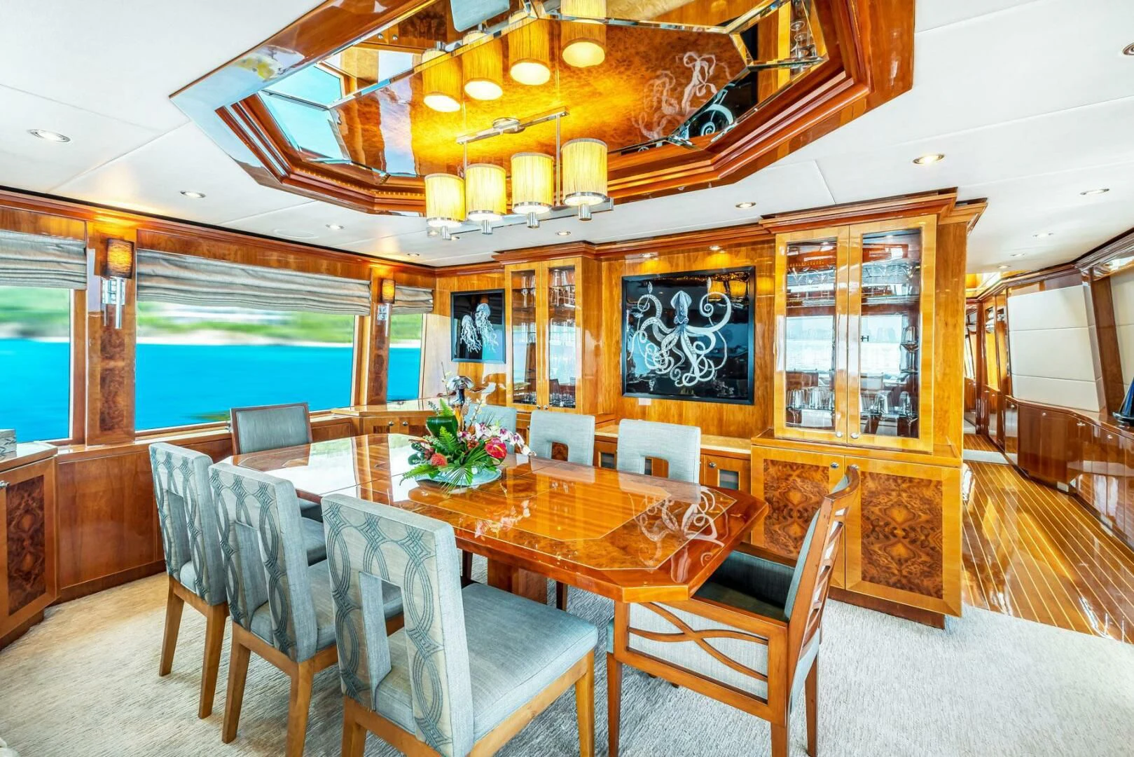 a dining room with a table and chairs aboard CYNDERELLA Yacht for Sale