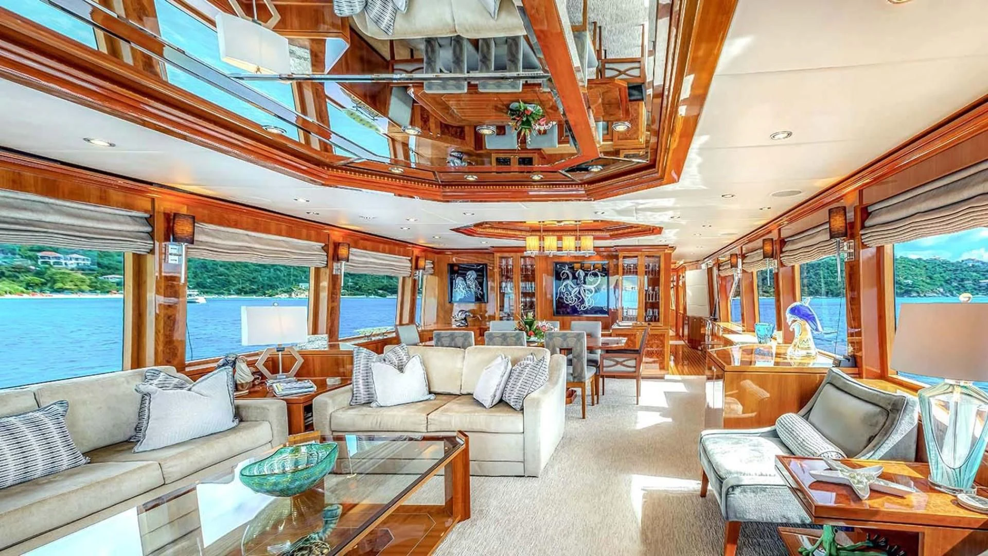 a living room with a large window aboard CYNDERELLA Yacht for Sale