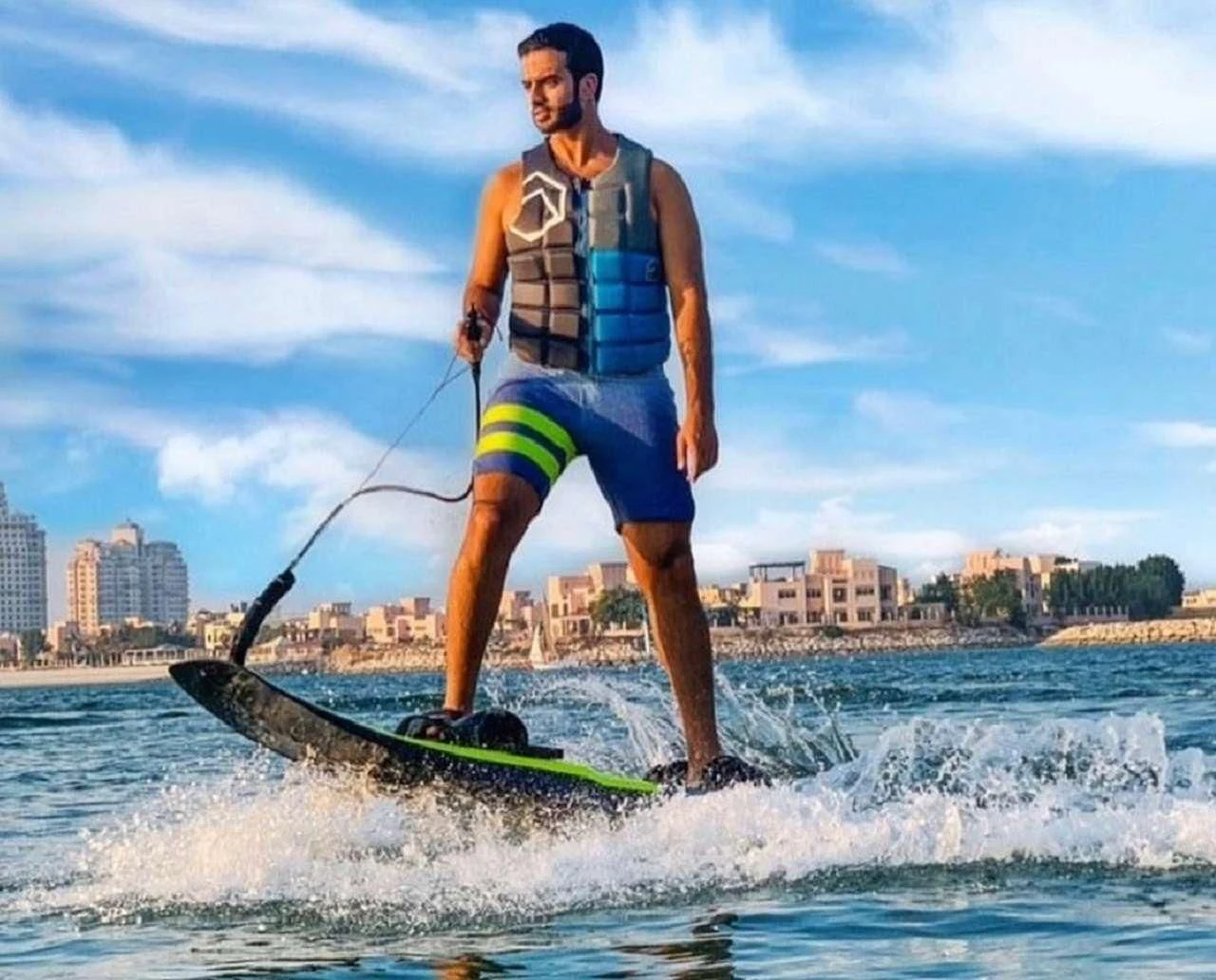 a man on a surfboard aboard CYNDERELLA Yacht for Sale