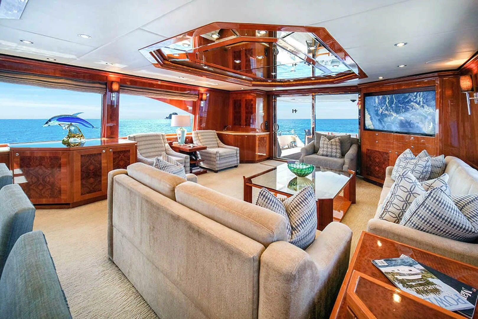 a living room with a large window aboard CYNDERELLA Yacht for Sale