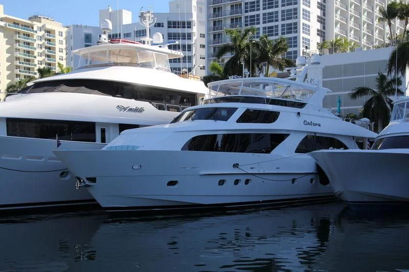 a group of white yachts in a harbor aboard CYNDERELLA Yacht for Sale