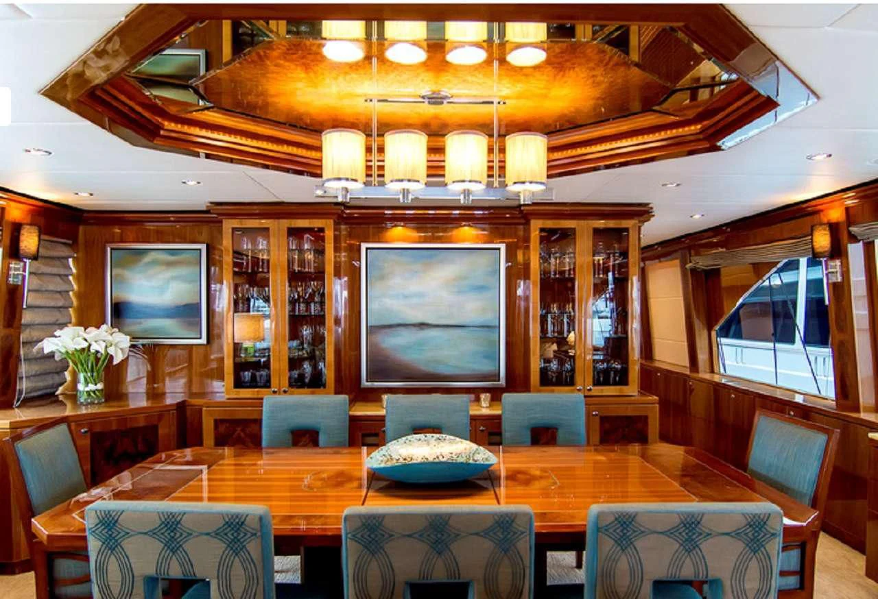 a room with a table and chairs aboard CYNDERELLA Yacht for Sale