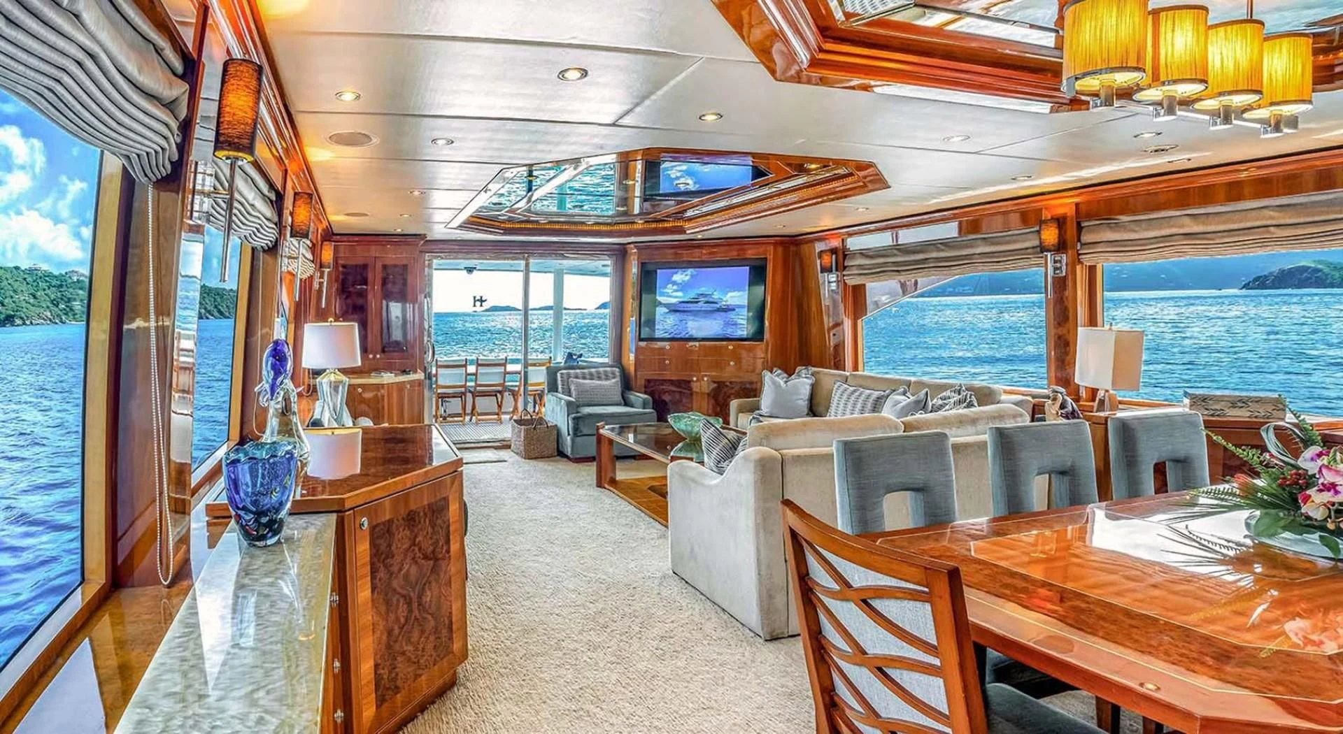 a living room with a large window aboard CYNDERELLA Yacht for Sale