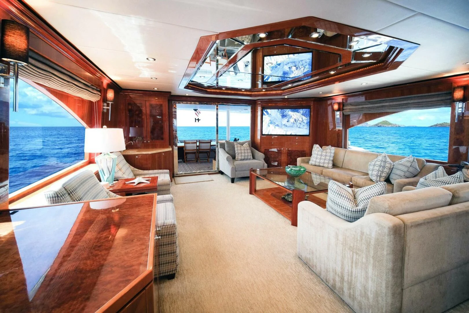 a large living room with a large open window aboard CYNDERELLA Yacht for Sale