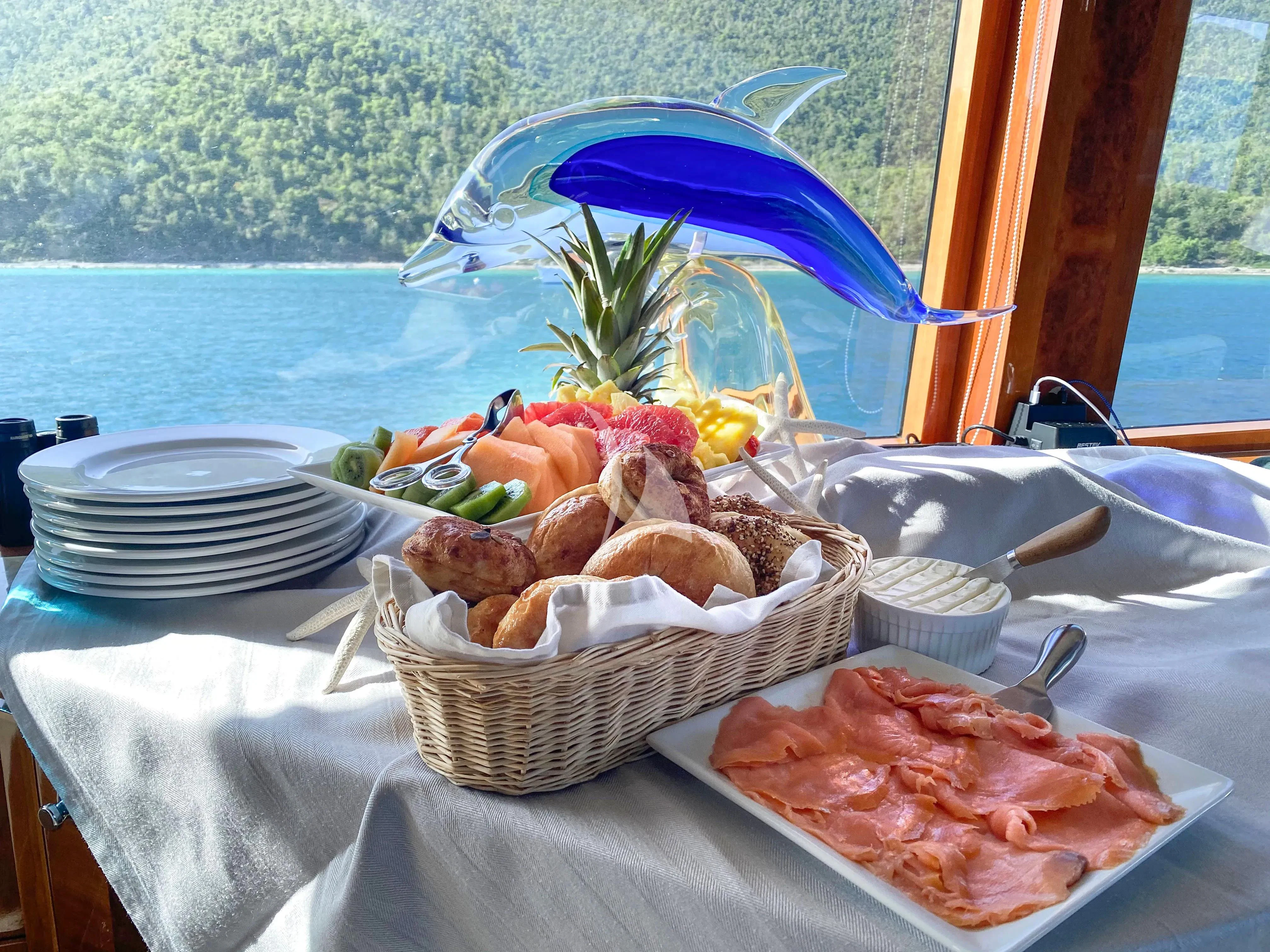 a table with food on it aboard CYNDERELLA Yacht for Sale
