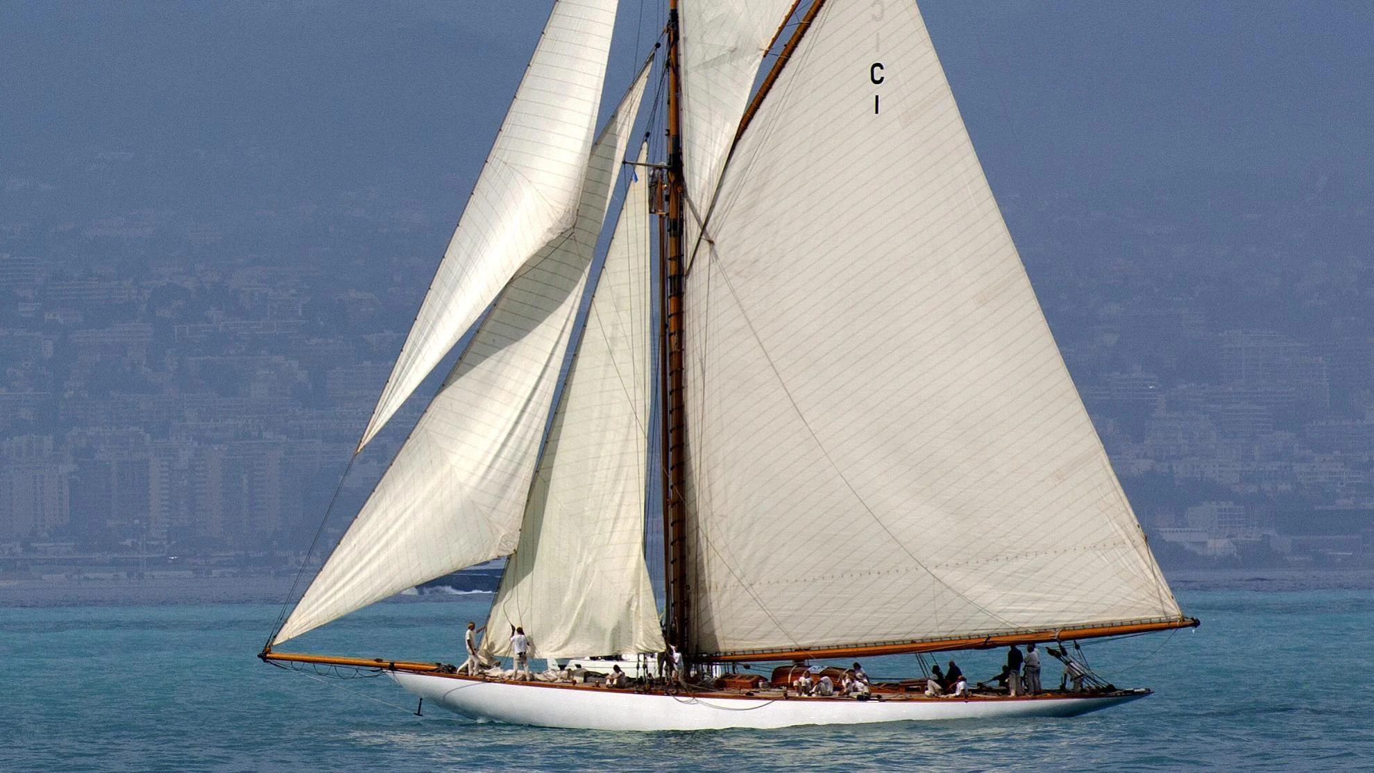 a sailboat with people on it aboard MARIQUITA Yacht for Sale