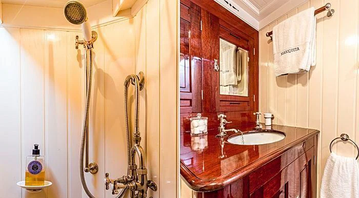 a bathroom with a sink and shower aboard MARIQUITA Yacht for Sale