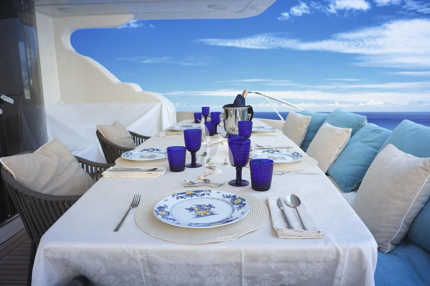 a table set for a dinner aboard RAMSES II Yacht for Sale