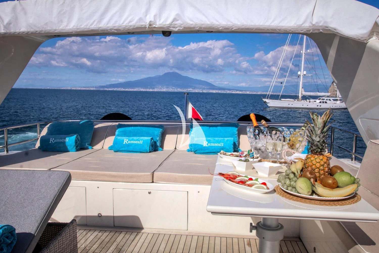 a table with fruit on it aboard RAMSES II Yacht for Sale