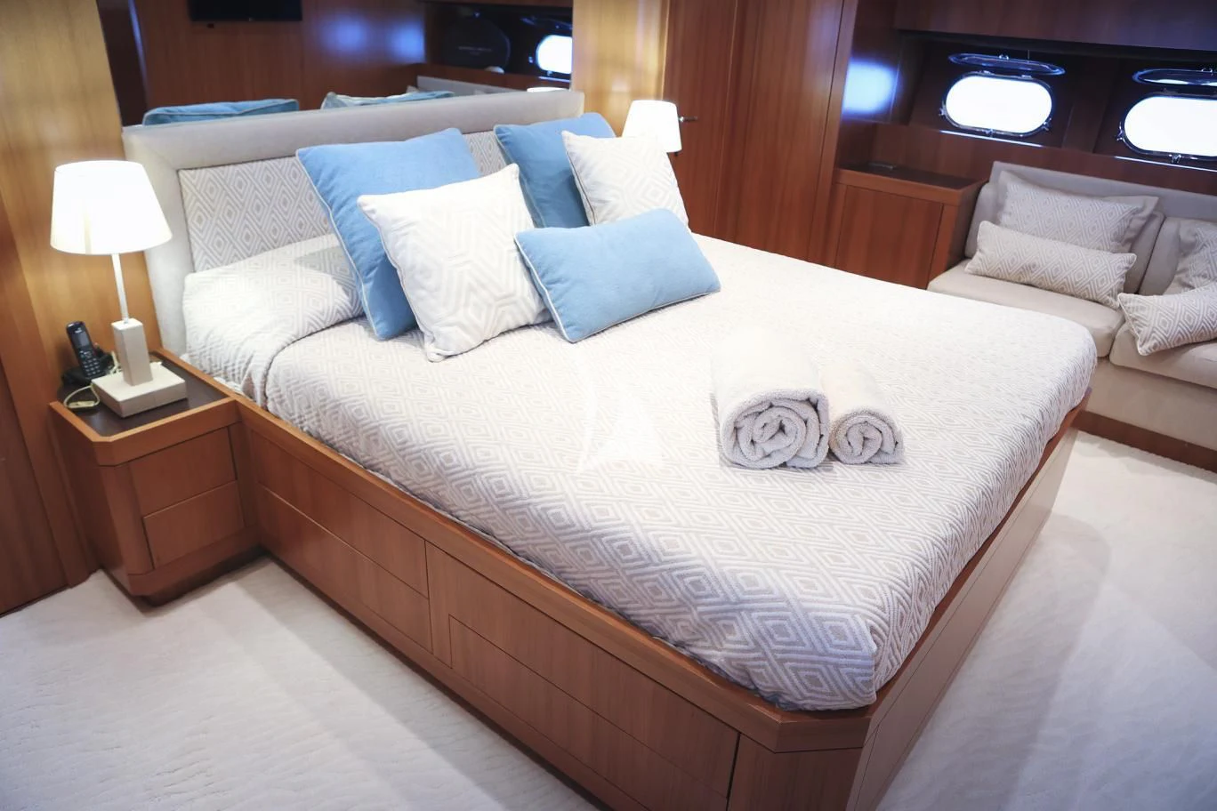 a bed with a white comforter aboard RAMSES II Yacht for Sale