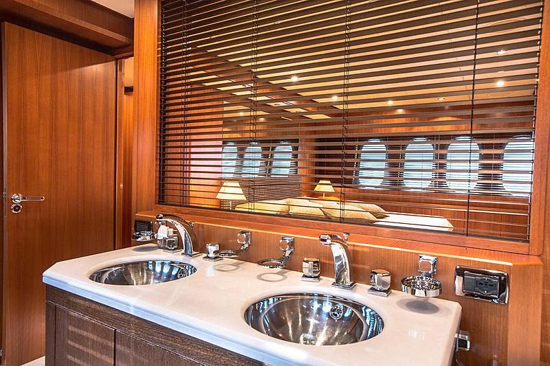 a bathroom with a sink and a large mirror aboard RAMSES II Yacht for Sale
