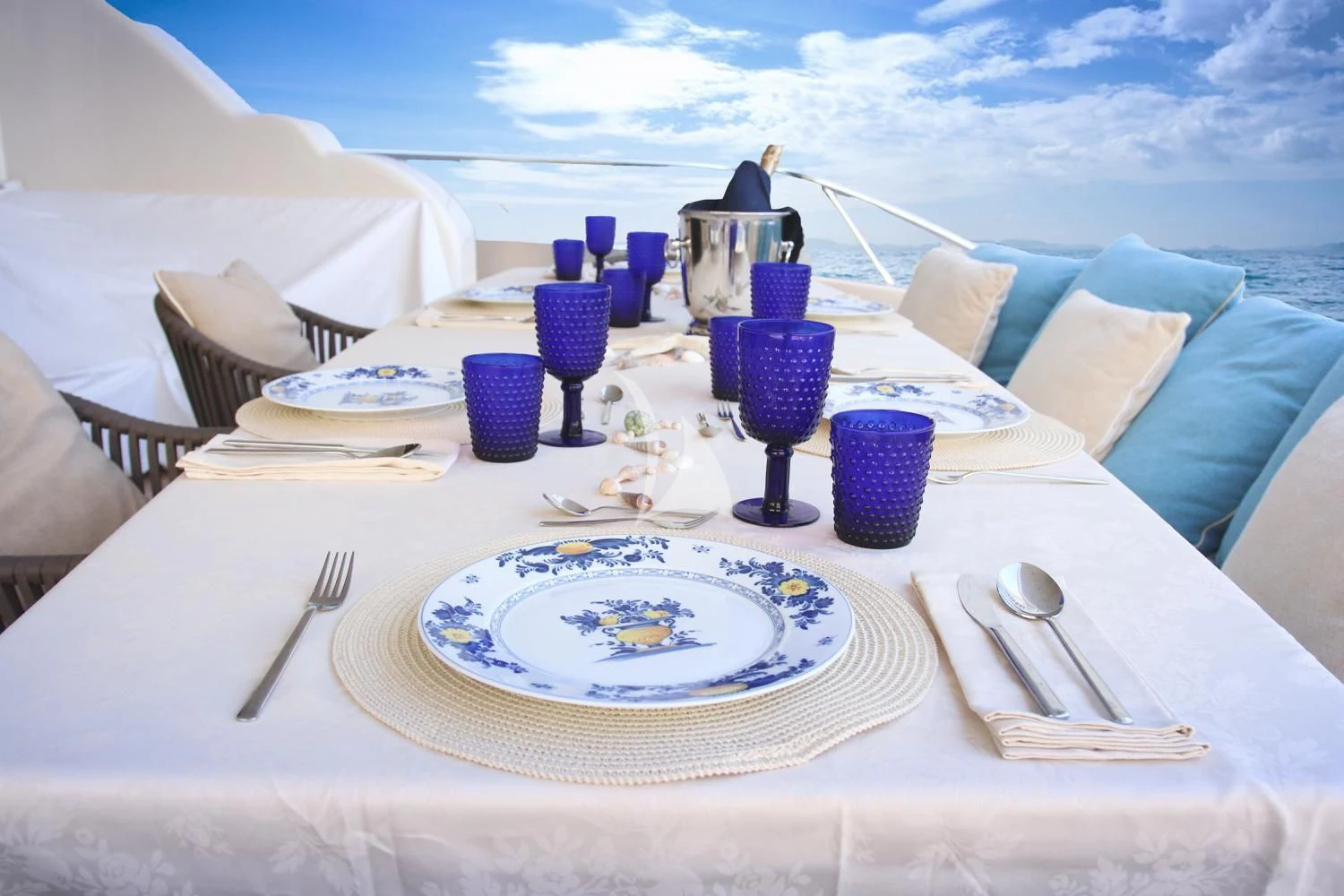 a table set for a dinner aboard RAMSES II Yacht for Sale
