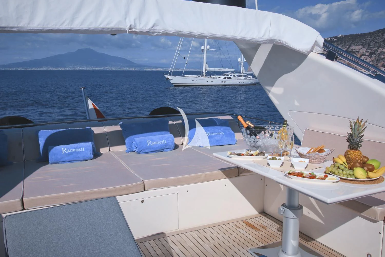 a table with food on it aboard RAMSES II Yacht for Sale