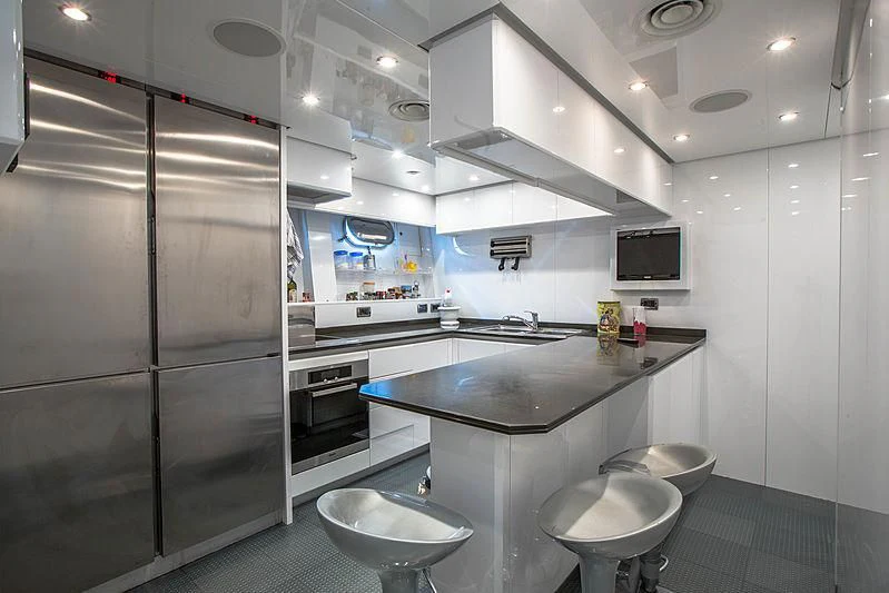 a kitchen with stainless steel appliances aboard RAMSES II Yacht for Sale