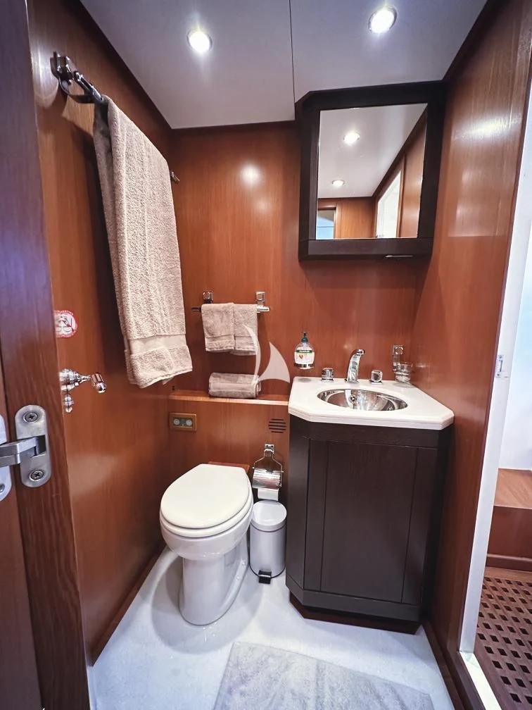 a bathroom with a toilet sink and a mirror aboard RAMSES II Yacht for Sale
